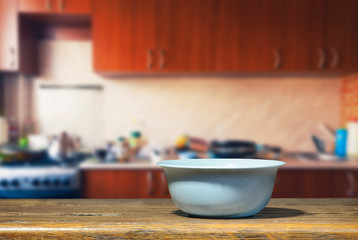 Fototapeta na wymiar Blue bowl on the kitchen table