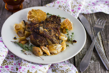 roasted meat with garlic and  herbs