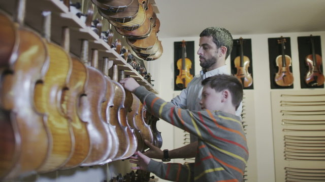 Craftsman in his workshop, making and restoring violins