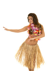 Hawaiian woman in grass skirt and coconut bra dancing
