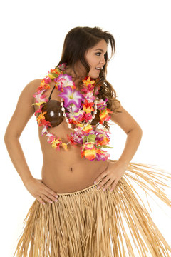 Hawaiian woman coconut bra grass skirt look side