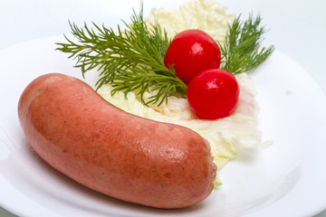 Cooked sausage with vegetables