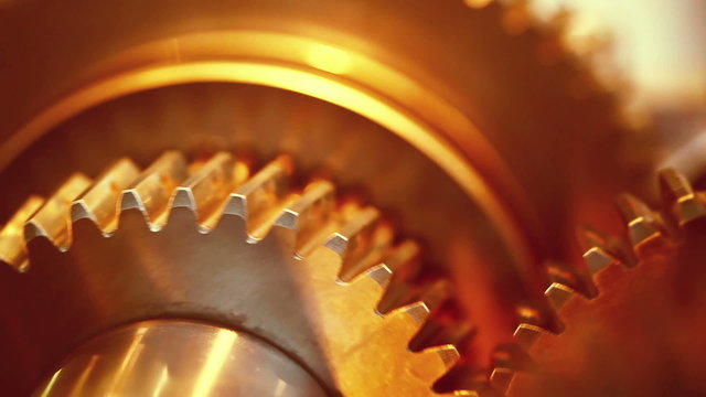 Golden gears with cogs in action. HD 1080p