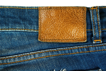 Brown leather label on blue jeans