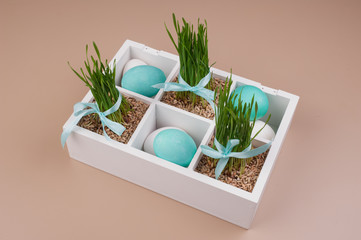 Easter eggs with grass decoration in box
