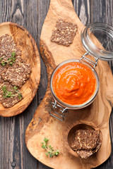 dip sauce roasted peppers and flax chips. top view