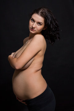 Pregnant woman posing nude