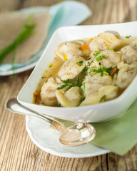 Dish of savory pork tortellini in broth pelmeni russian