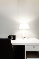 Workspace with desk lamp on home or studio