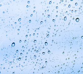 background in the form of water drops on the blue