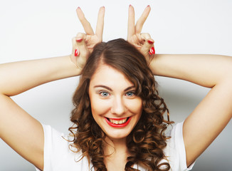 Fototapeta premium Funny woman doing hand sign