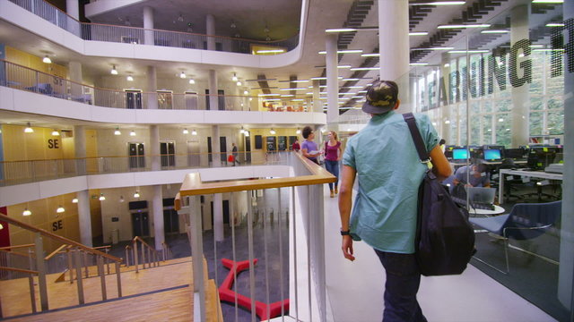 Diverse group of students in large modern university building