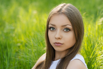 Portrait of a young girl on the nature