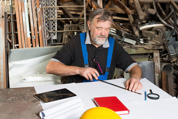 engineer at work, drawings, documents