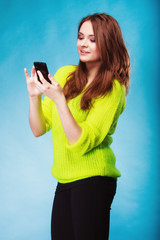 Teenage girl with mobile phone texting