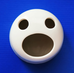 Anthropomorphic face eyes open mouth