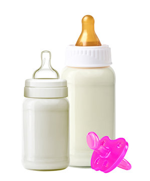 baby milk bottles and dummy isolated on white