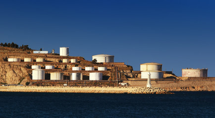 Sea with oil tanks