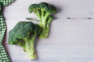 Fresh broccoli on the wooden table - Powered by Adobe