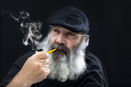 Senior portrait with white beard and pipe