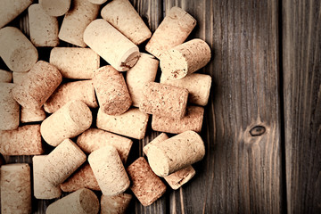 Wine corks on wooden background
