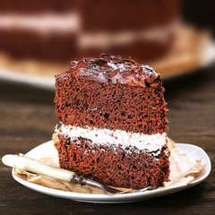 Delicious chocolate cake on table close-up