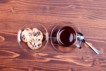 chocolate chip cookies with coffee on the board top view