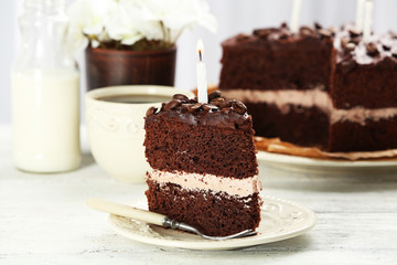 Delicious chocolate cake on table on light background
