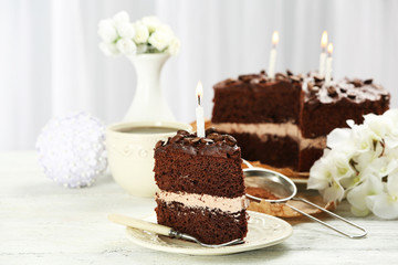 Delicious chocolate cake on table on light background