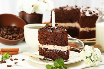 Delicious chocolate cake on table on light background