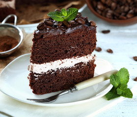 Delicious chocolate cake on table close-up