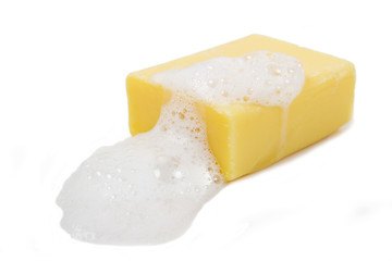 Yellow soap bubble of isolation on a white background