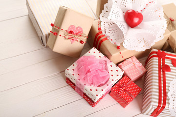 Beautiful gift boxes on wooden background. Valentine Day