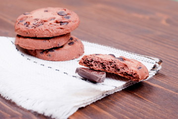 Delicious chocolate chip cookies on the board top view