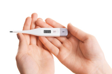 Female hands holding thermometer isolated on white