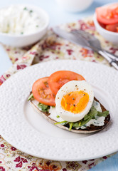 Rye toast sandwiches with egg and soft cheese