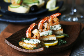Appetizer canape with shrimp and lemon