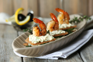 Appetizer canape with shrimp and cucumber