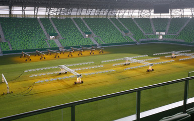 Obraz premium Lighting rig system for growing grass and lawn at stadium