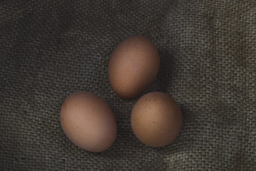 Eggs on sackcloth background