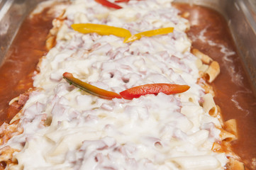 Pasta with beef in white sauce at a restaurant buffet