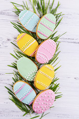 Delicious Easter cookies on wooden background