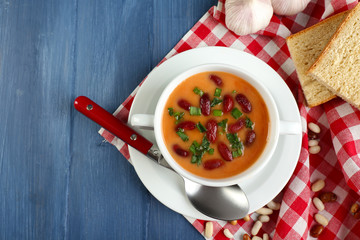 Bean soup in bowl with fresh sliced bread