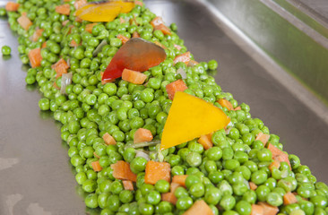 Peas and carrots at a restaurant buffet