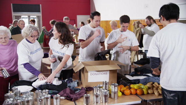 Charity volunteers sorting through donated goods