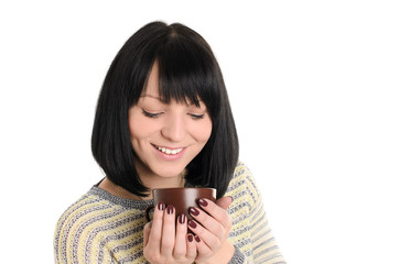 young woman with cup of tea or coffee in hands