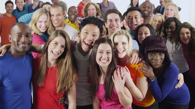 Happy multi-ethnic group of friends in colorful casual clothing