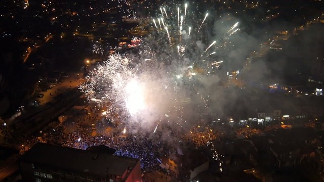 Aerial view on the big fireworks and concert at the city center