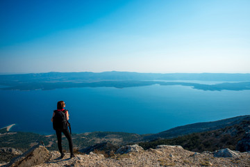 Fototapeta premium Woman traveling on the island top