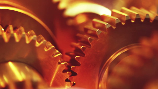Golden gears with cogs in action. HD 1080p, Loop-ready
